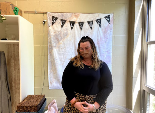 Ms. Emily Stoll stands in her classroom. (Photo by Allison Feeney)