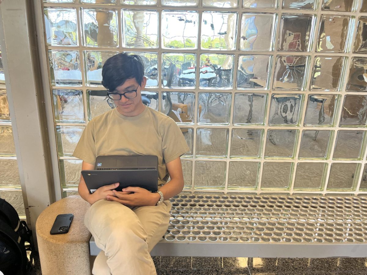 Student, Jimi Gutierrez Clark, does homework during his lunch