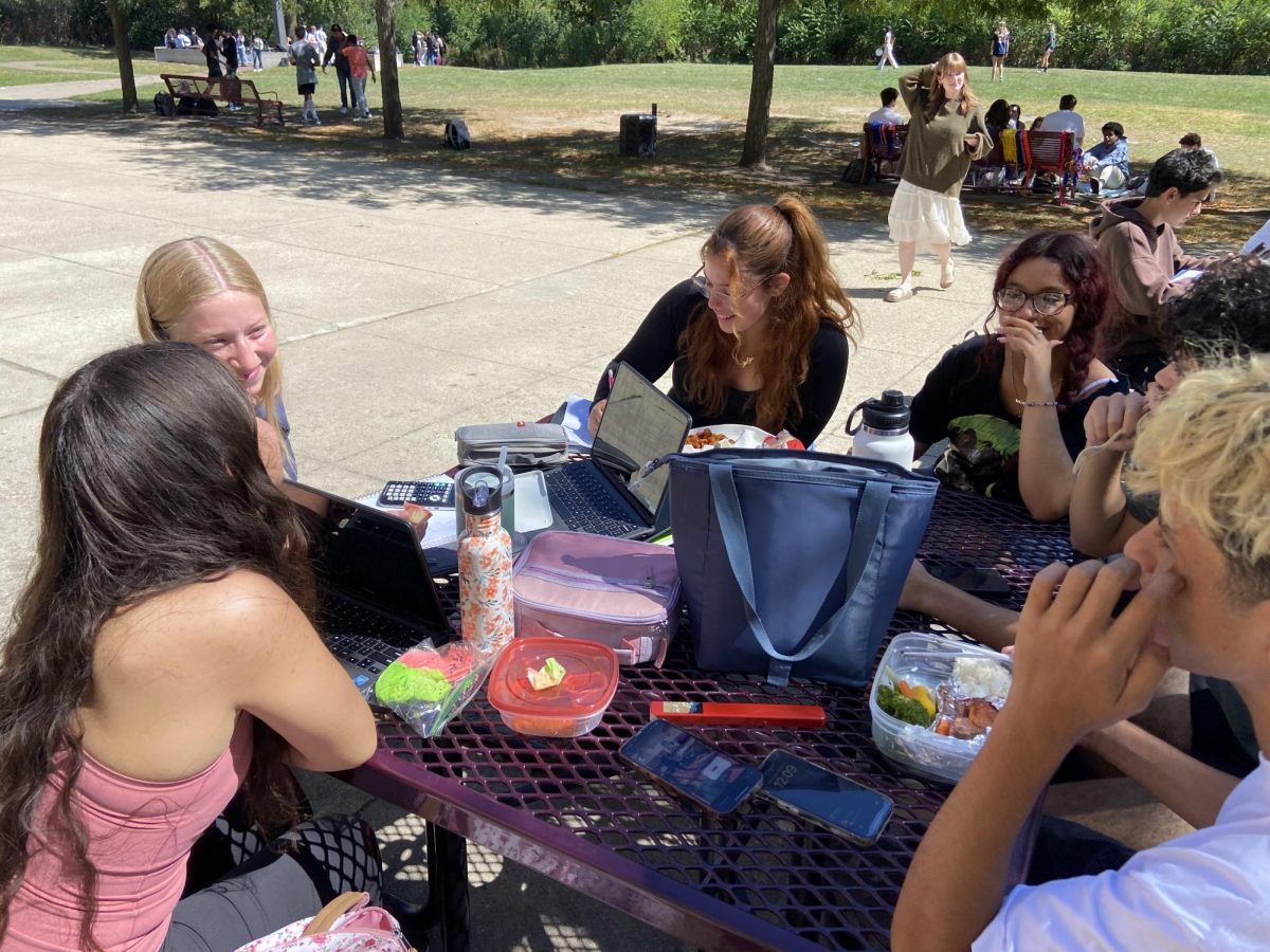 A group of friends sitting outside for lunch