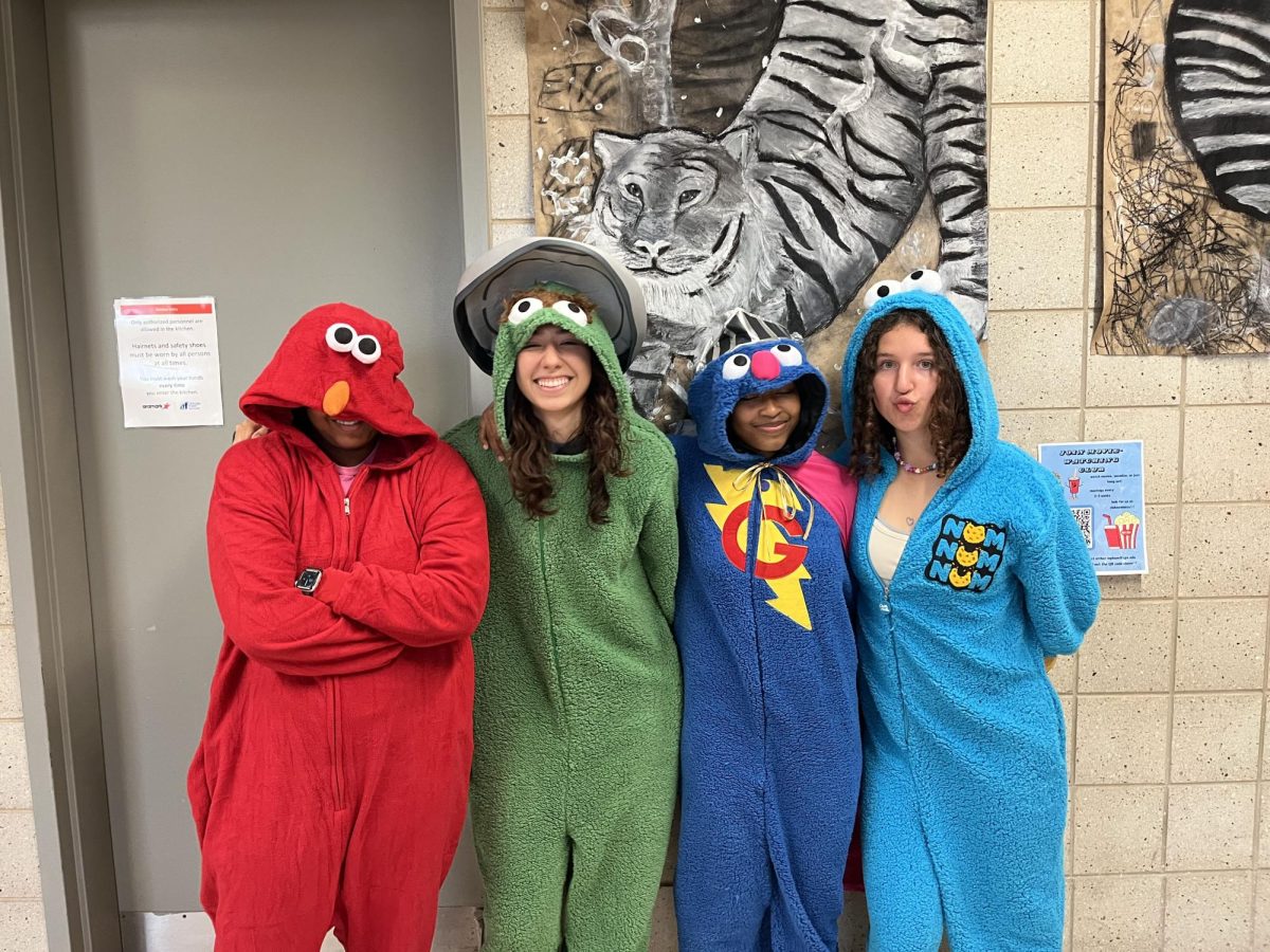 Seniors Gaya, Jasmine, Viviane, and Rosali dress up as Sesame Street characters