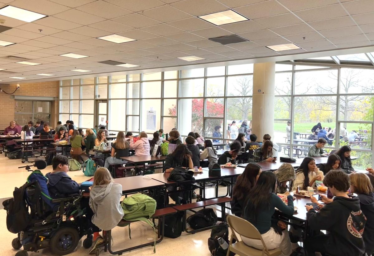 Students enjoying their lunch in the cafeteria.