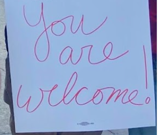 Photo of a a teacher's sign reading "You are welcome"