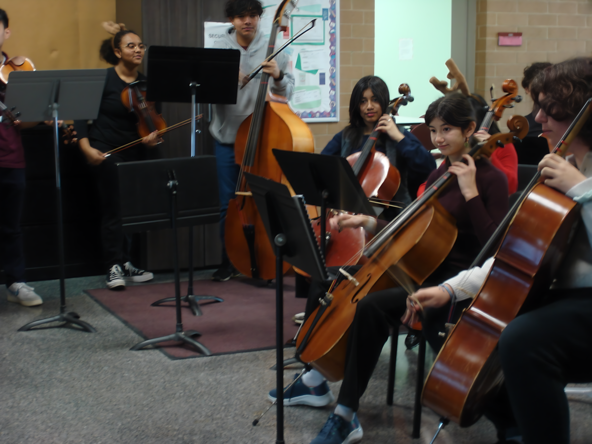 Orchestra students performing in the hallway before class.