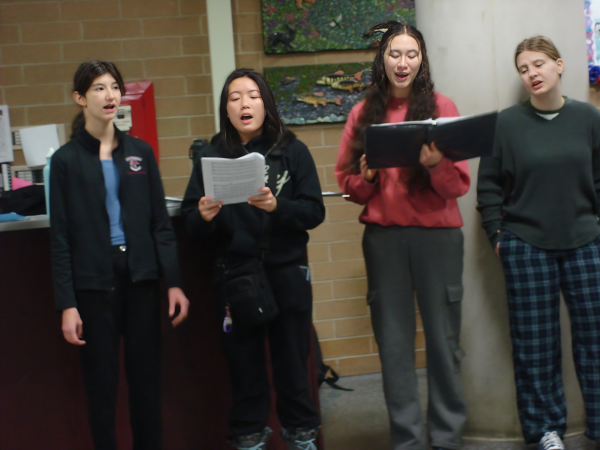 Choir students performing in the hallways before class. (sopranos)