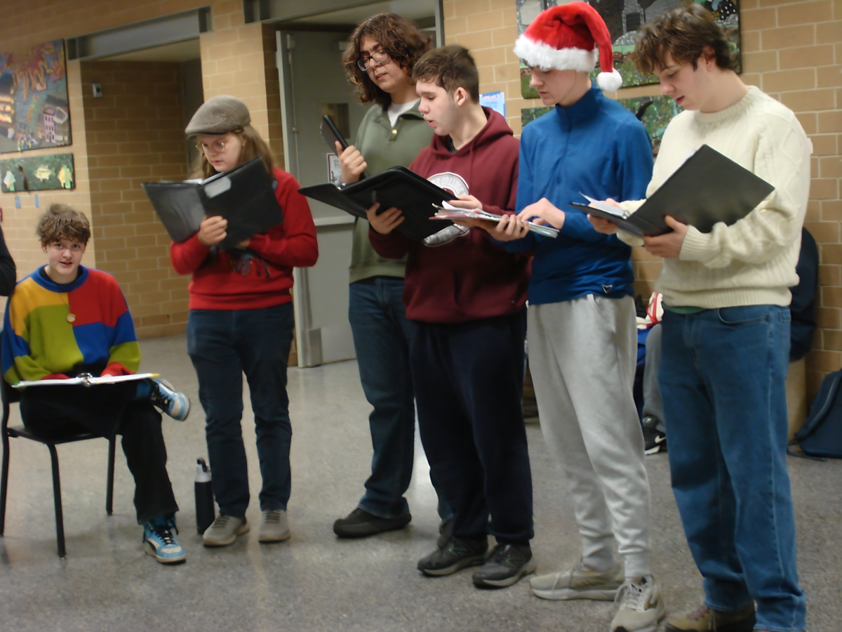 Choir students performing in the hallways before class. (bass)