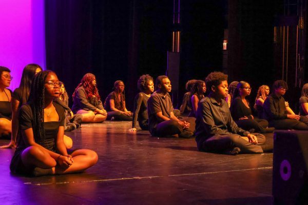 Students sitting on stage taken by Jacky Bu.